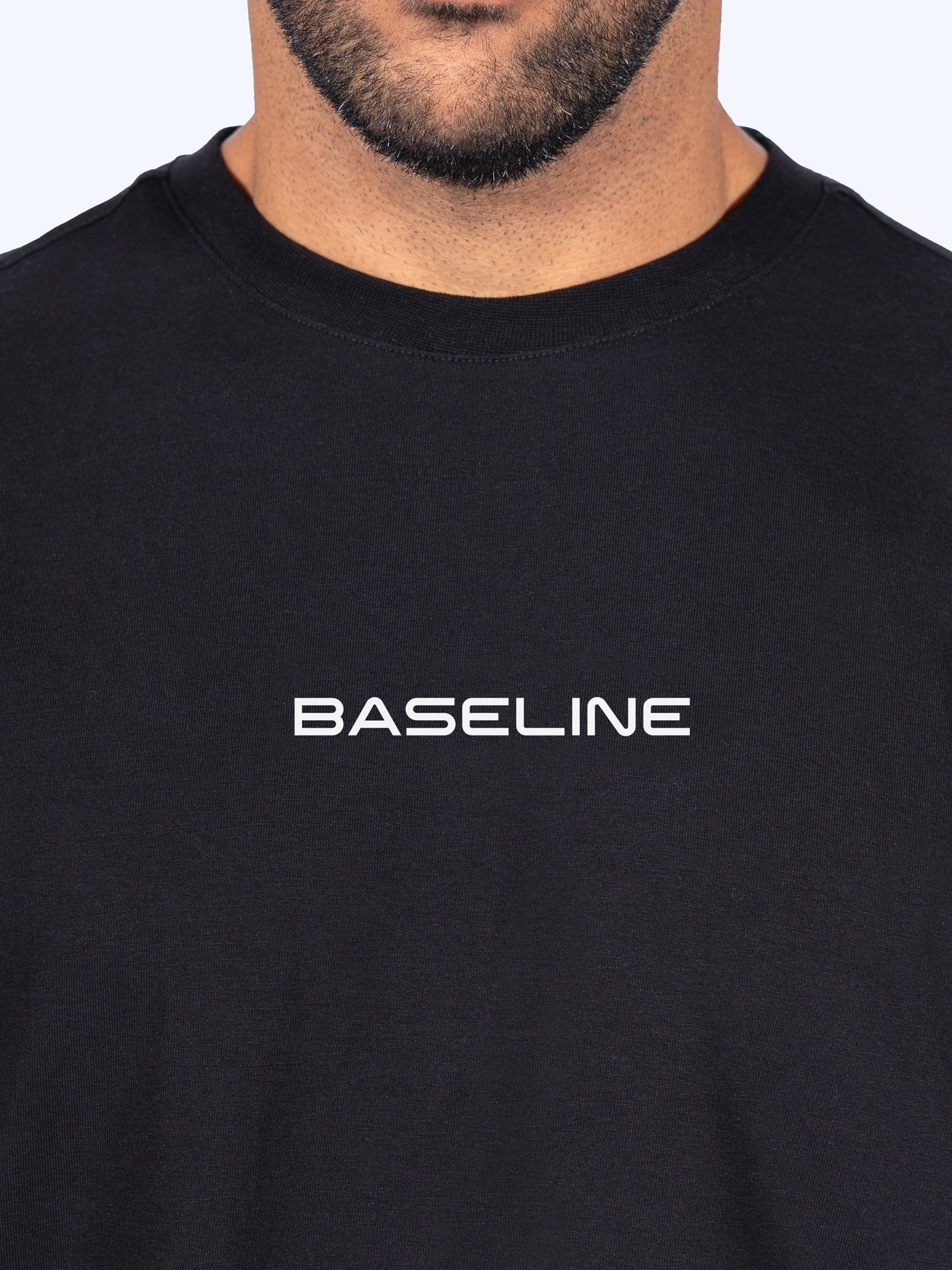 Black 'Icon Oversized' t-shirt with 'BASELINE' text on a plain background